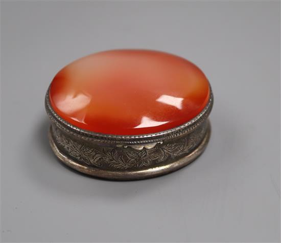 An early 19th century German white metal and agate set oval snuff box, 52mm.